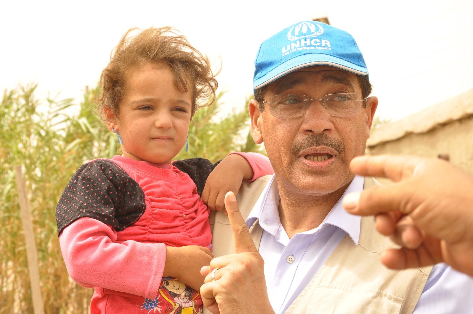 Meeting a young refugee during a protection and field-monitoring visit.