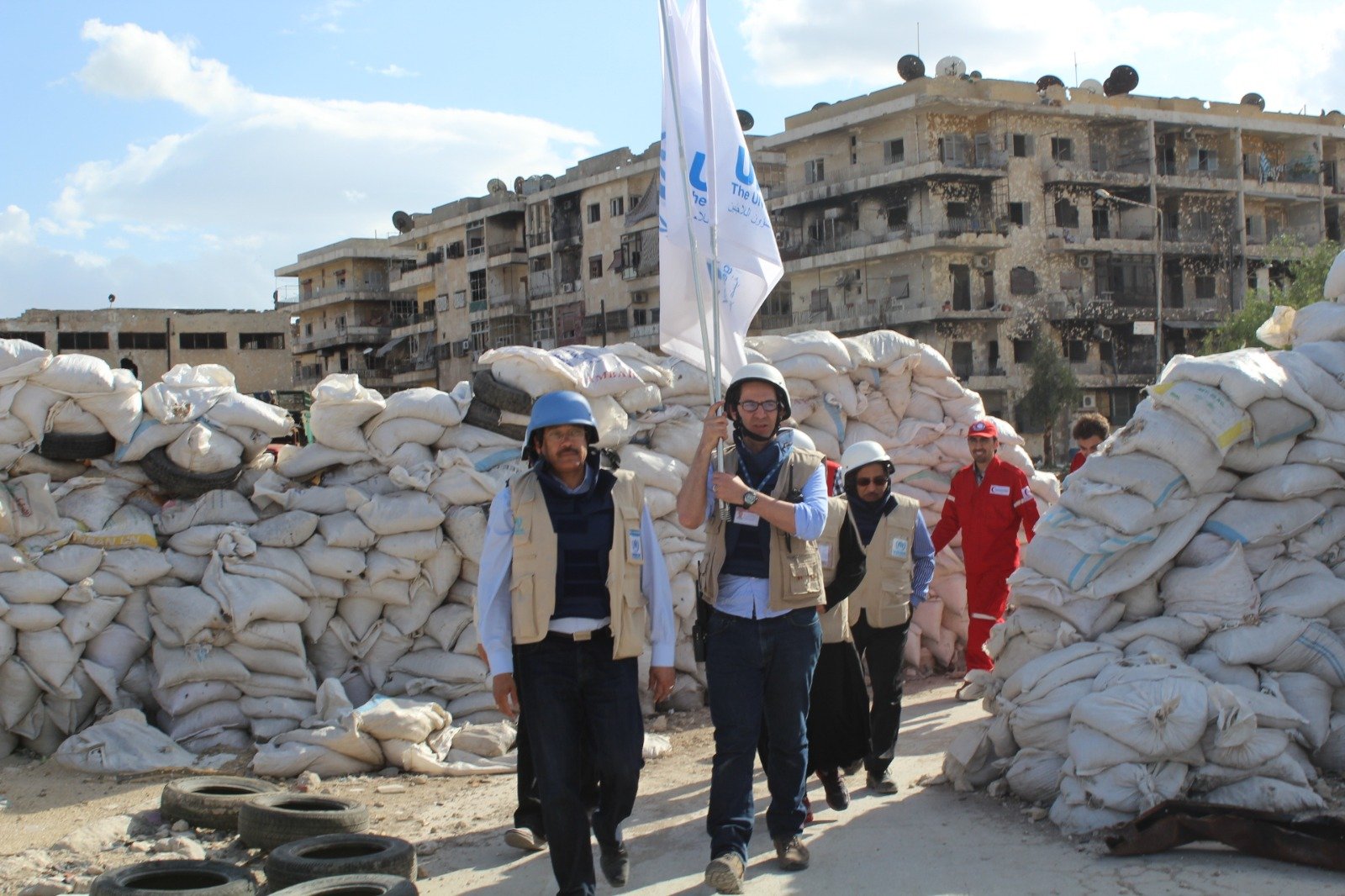 Leading a UNHCR cross-line convoy into a besieged area of Syria to deliver life-saving assistance.